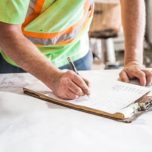 working man contractor signing or writing something